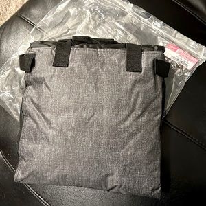 Thirty-one black bleacher, blanket. Folds up into easy to carry pillow.